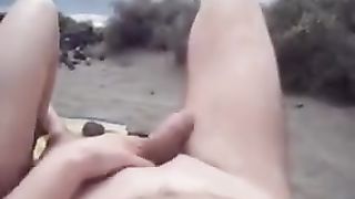 Makes blowjob on the beach